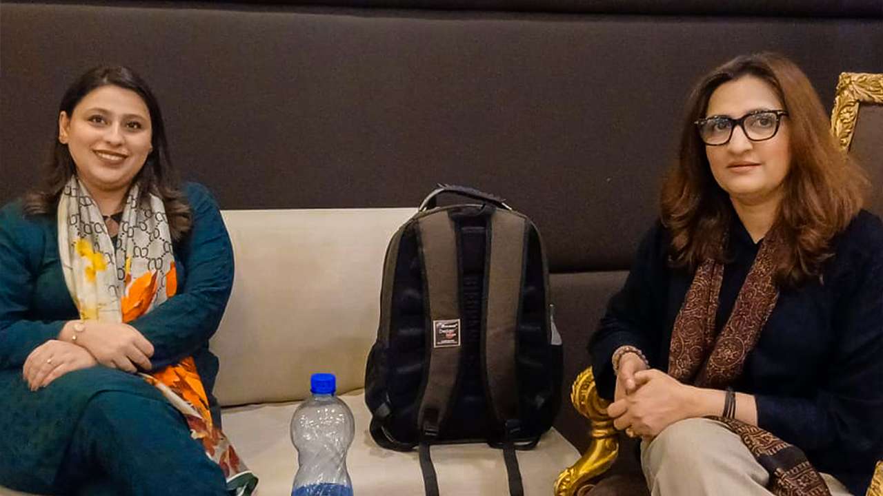 Corporate wellness event with Fatima Memorial experts Dr. Usama Bin Zubair speaking at MedIQ wellness event Corporate employees engaged in mental health discussion