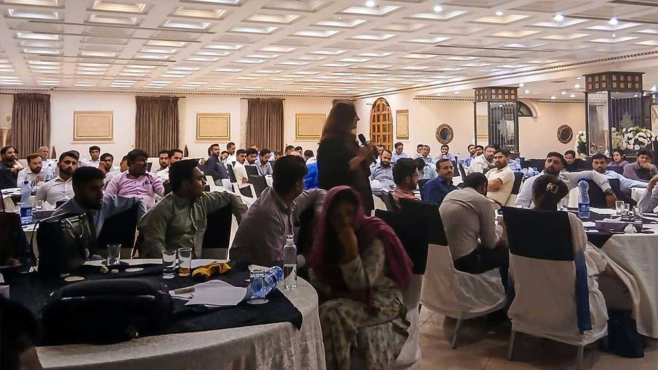 Mental health experts from Fatima Memorial Hospital conducting corporate wellness session in Lahore MedIQ Smart Healthcare team coordinating mental wellness initiative with Abbott across Pakistan