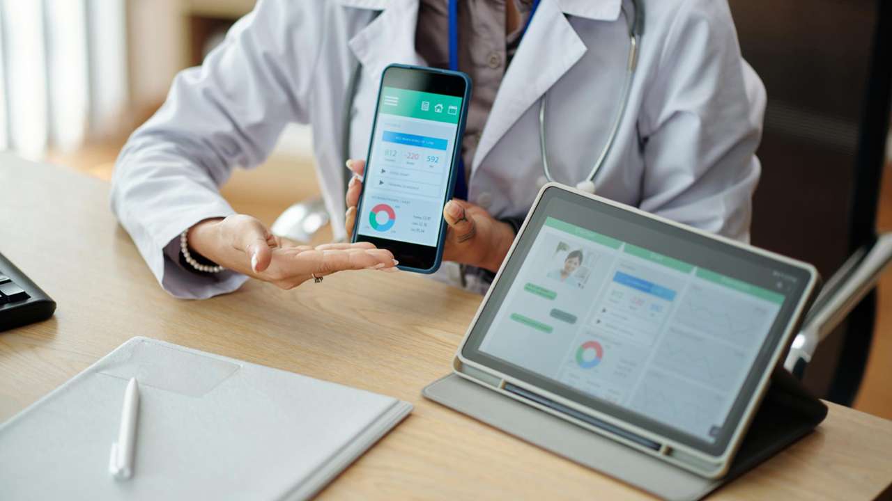 “Electronic medical records in Pakistan healthcare” “Doctor using digital health platform on laptop” “EHR system dashboard for patient data management” “Electronic health records improving hospital efficiency” “Healthcare digital transformation with MedIQ”